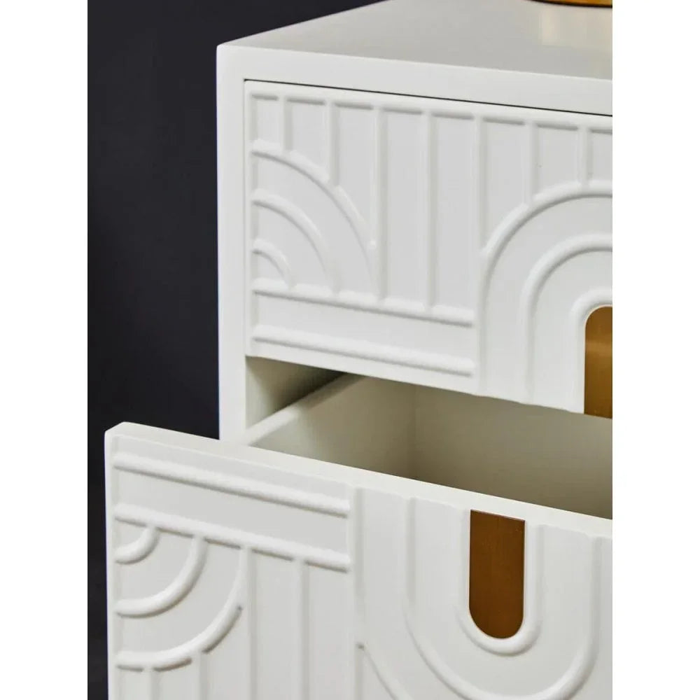 White textured bedside table with open drawer showing geometric pattern detail
