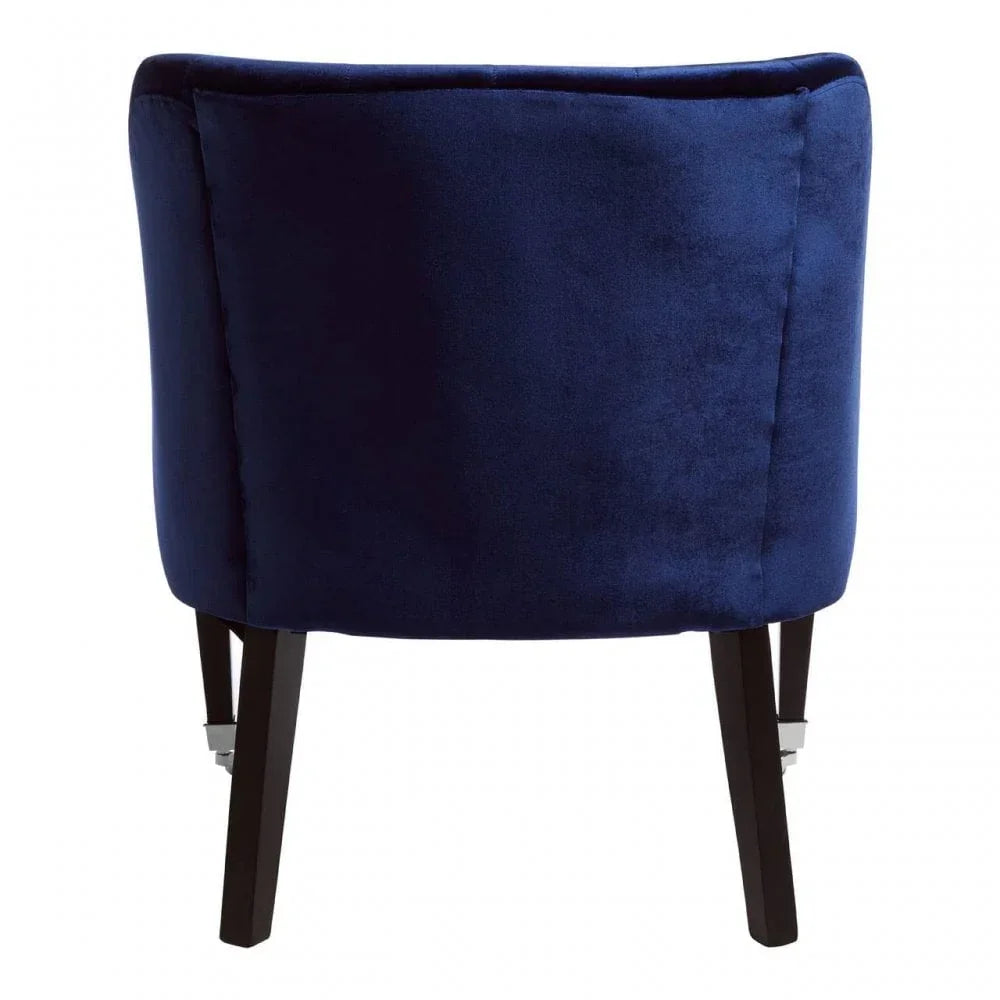 Rear view of navy velvet accent chair with dark wooden legs