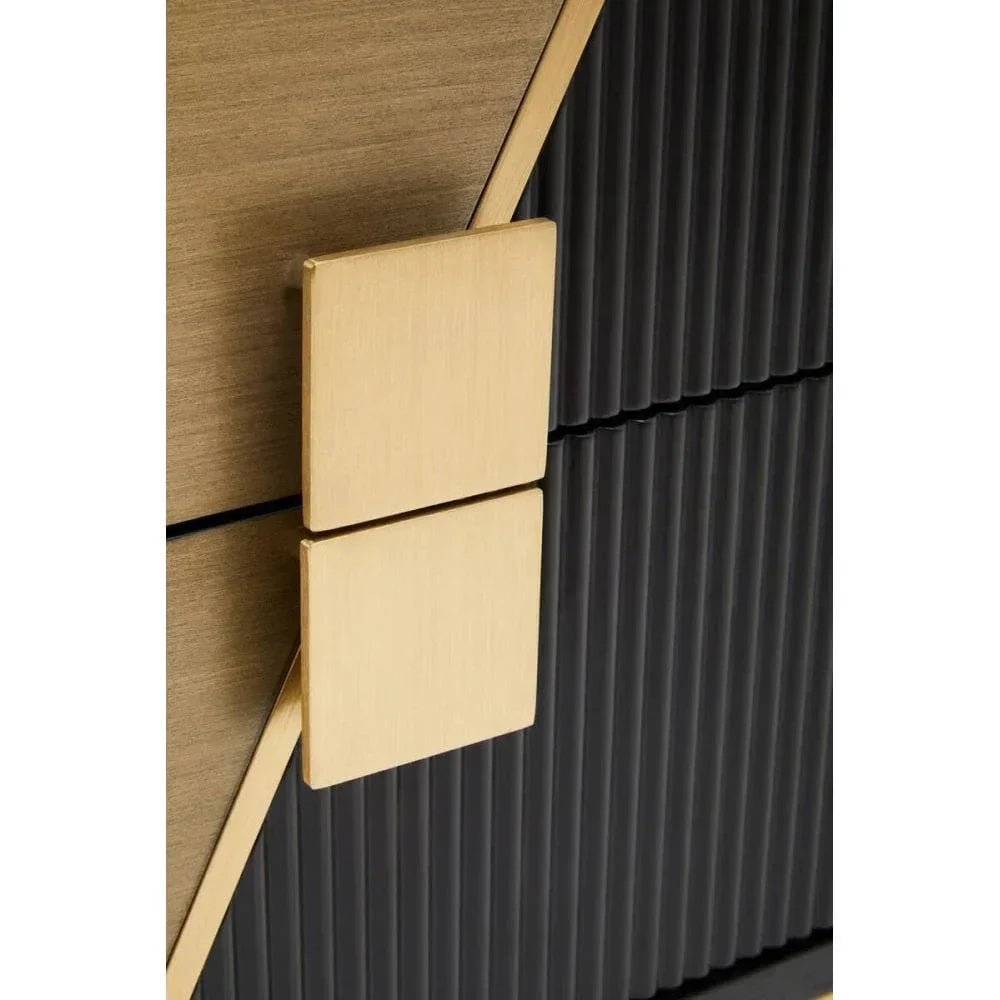 Close-up of black ribbed cabinet with gold square handles and wooden panel accent