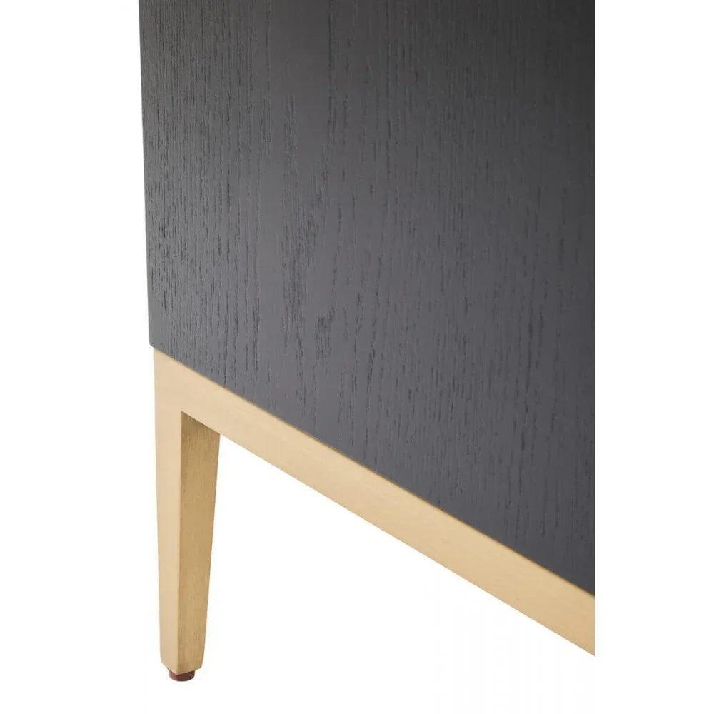 Close up of black wood cabinet with light oak leg and trim detail