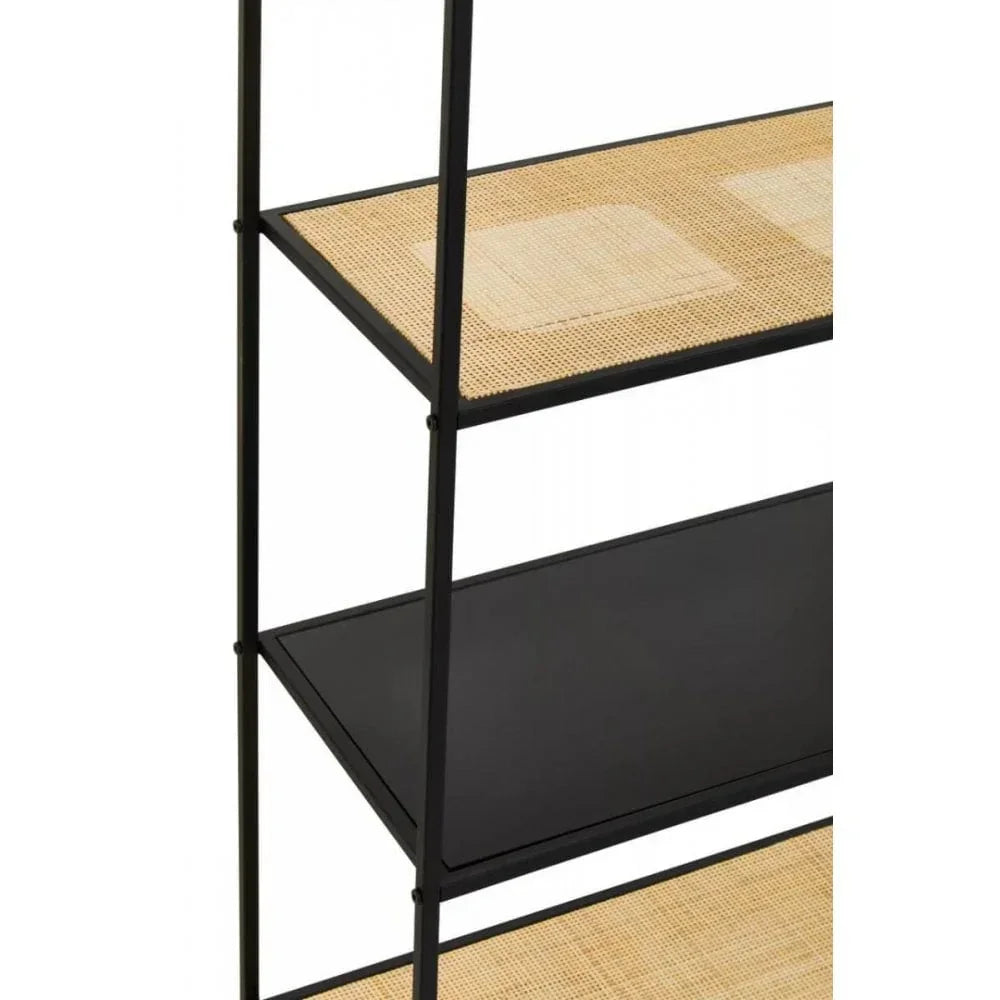 Black metal shelving unit with rattan shelves and panel detail, side angle view