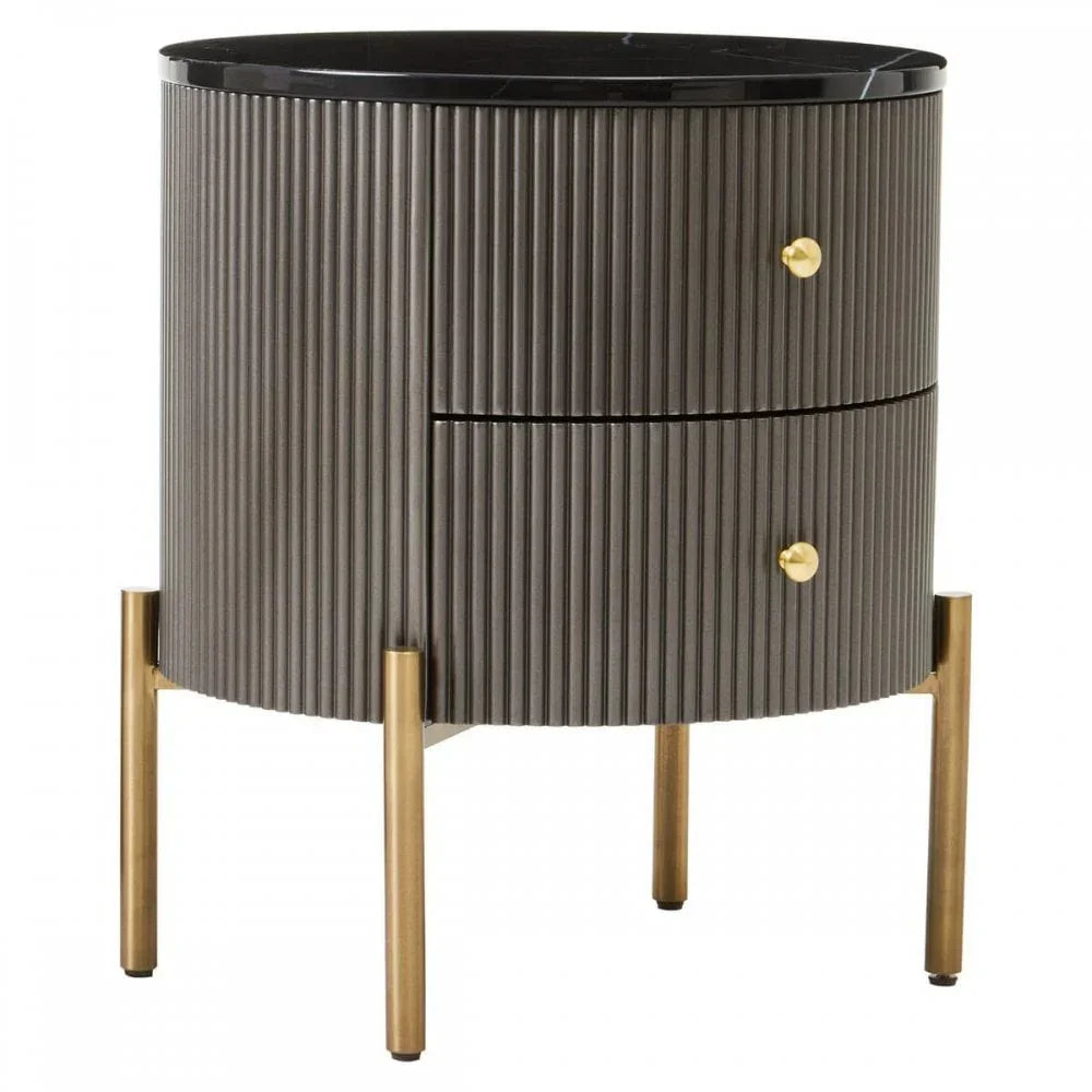 Black ribbed bedside table with gold legs and handles, two drawers, marble top