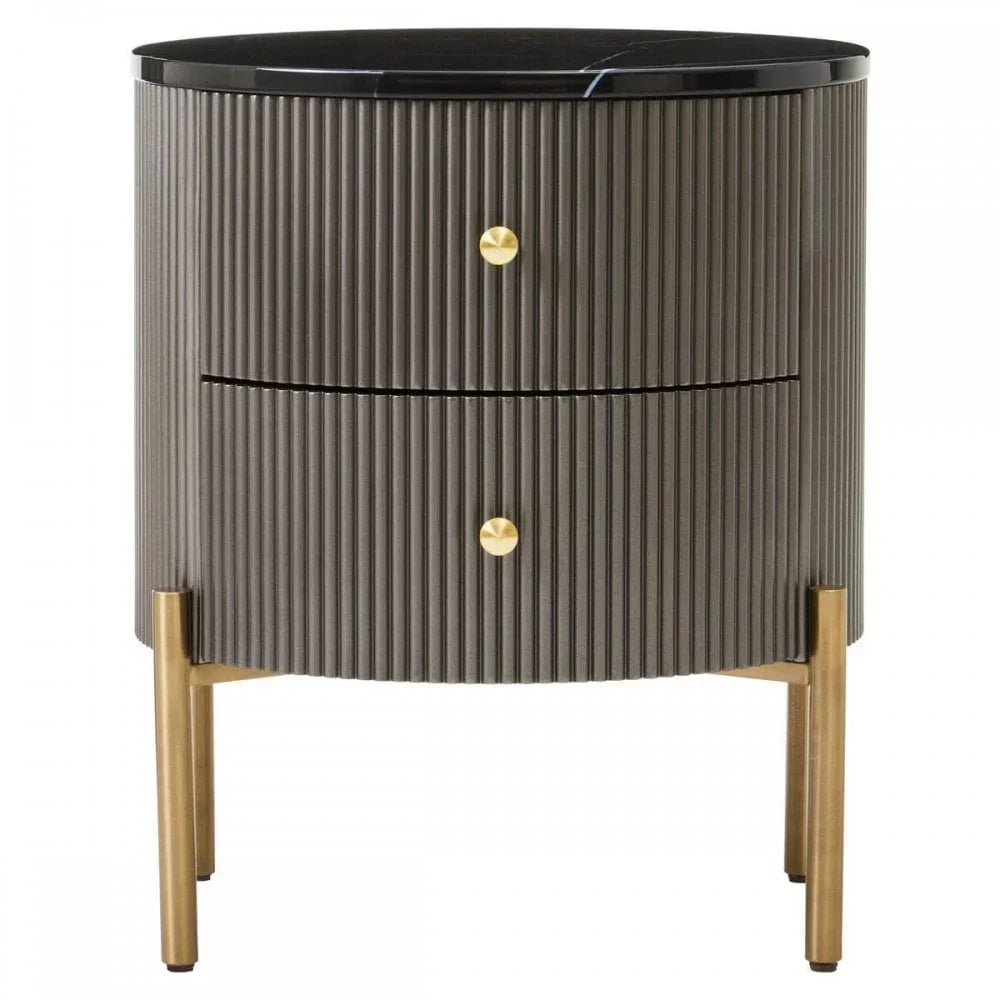 Modern bedside table with ribbed grey finish, brass legs, black marble top, and two drawers