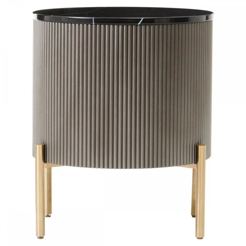 Modern round side table with ribbed grey finish, black top and gold metal legs
