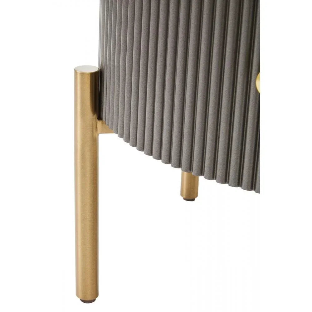 Textured grey cabinet detail with gold metal legs, modern ribbed bedroom furniture