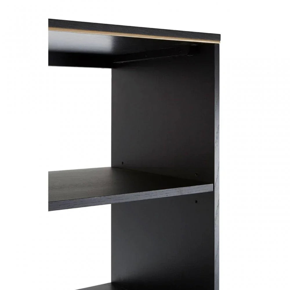 Close-up of black wood shelving unit with visible shelves and gold accent strip