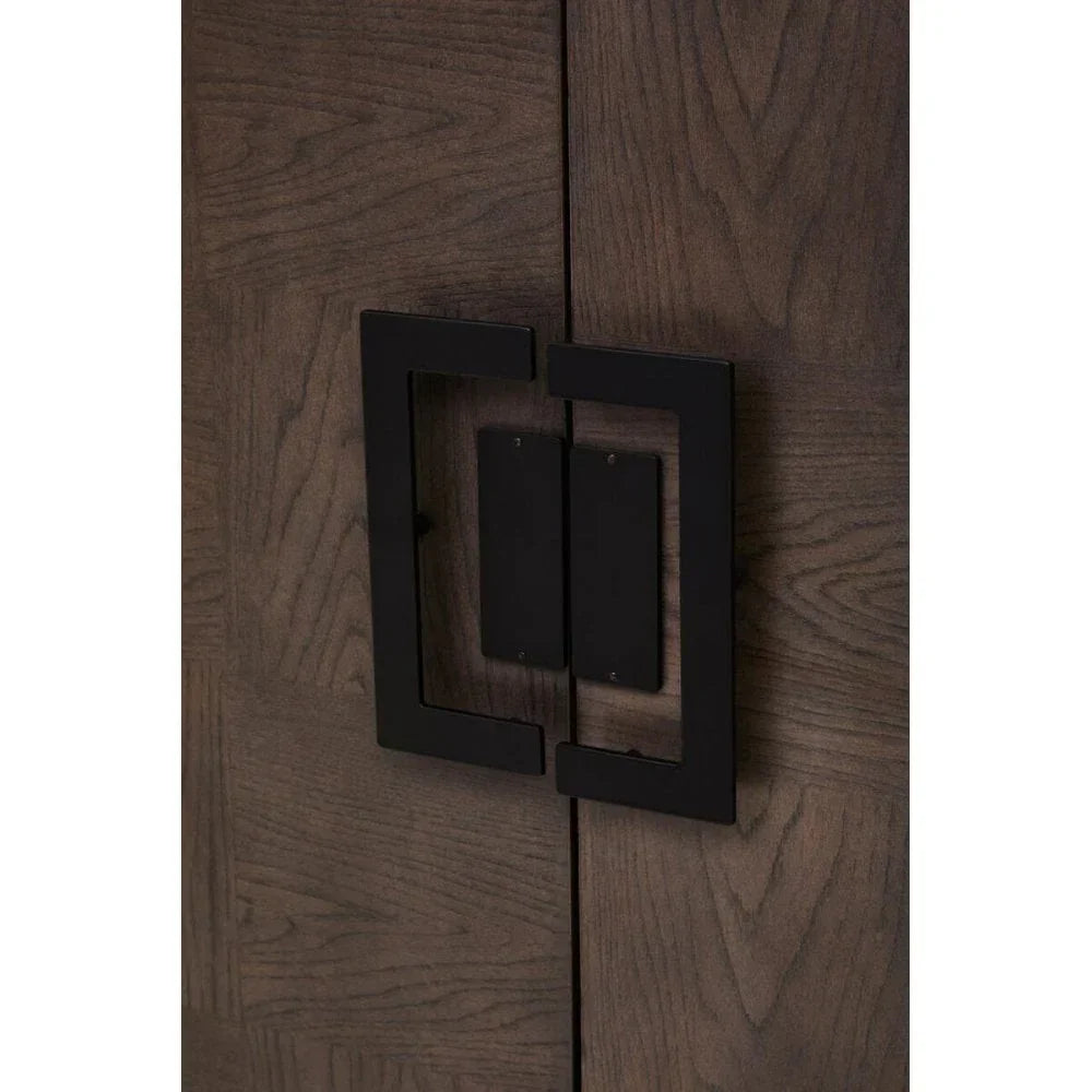 Closeup of dark wood cabinet door with black metal square handles