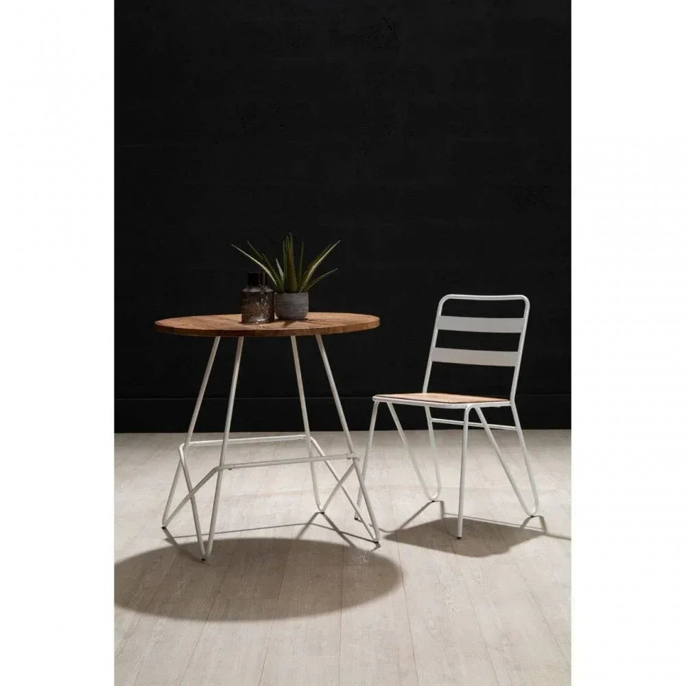 Modern dining set with round wood table and metal chair on light wooden floor