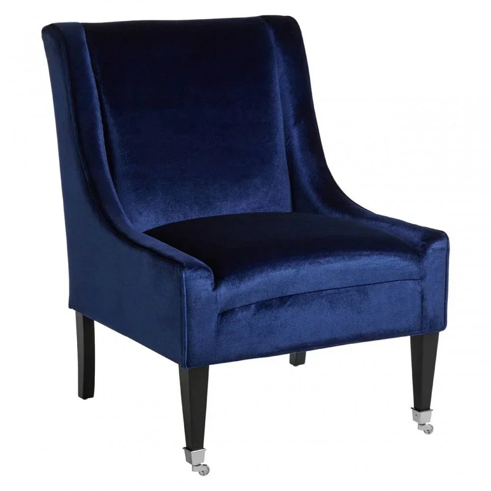 Blue velvet accent chair with black wooden legs and chrome castor wheels