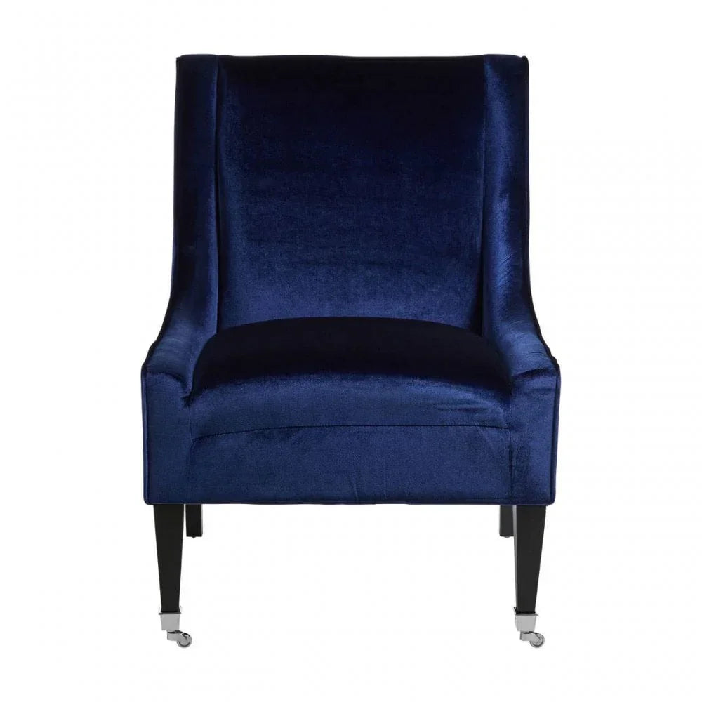 Navy blue velvet accent chair with curved back and black wooden legs on castor wheels