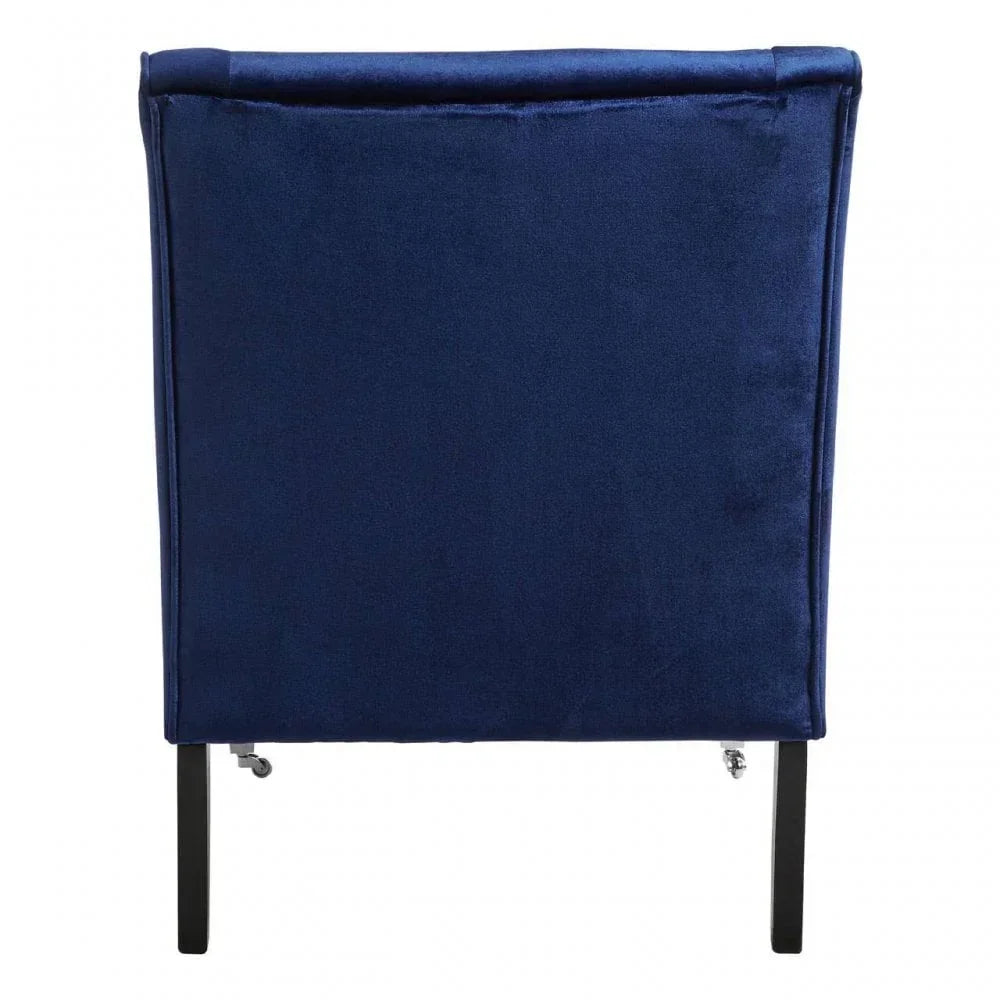 Rear view of blue velvet dining chair with black legs on a white background