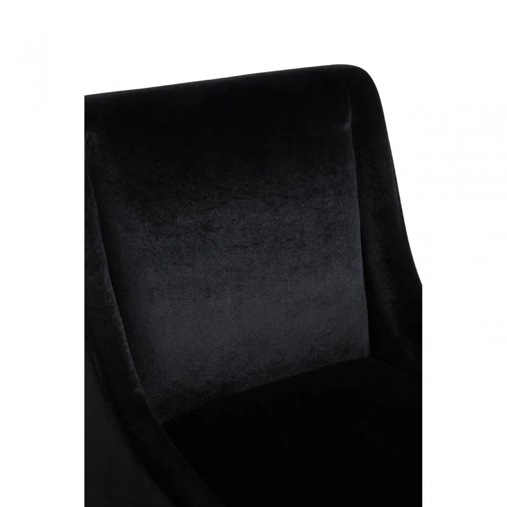 Close up of black velvet armchair backrest highlighting soft upholstery texture