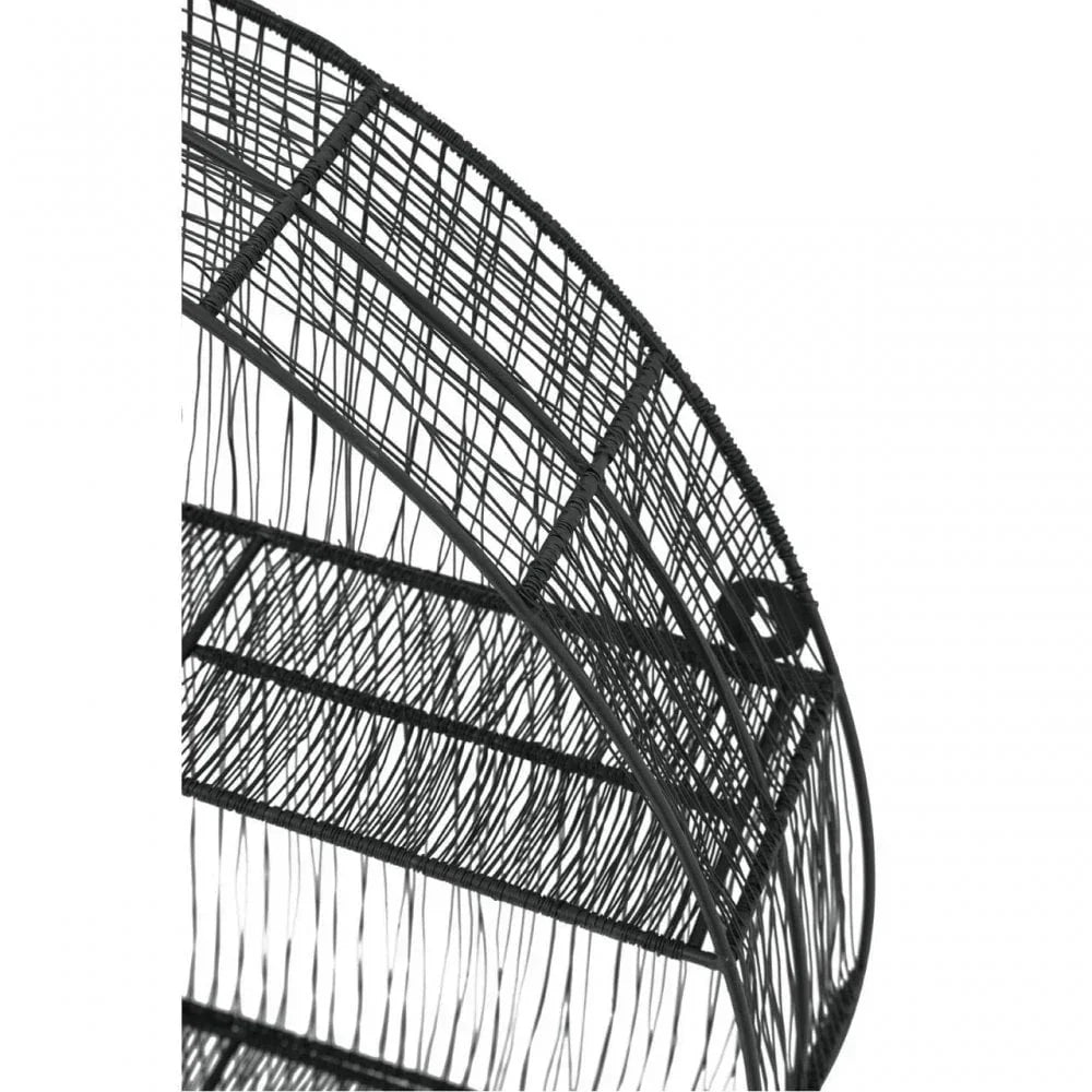 Close-up of black woven rattan chair frame highlights modern furniture design