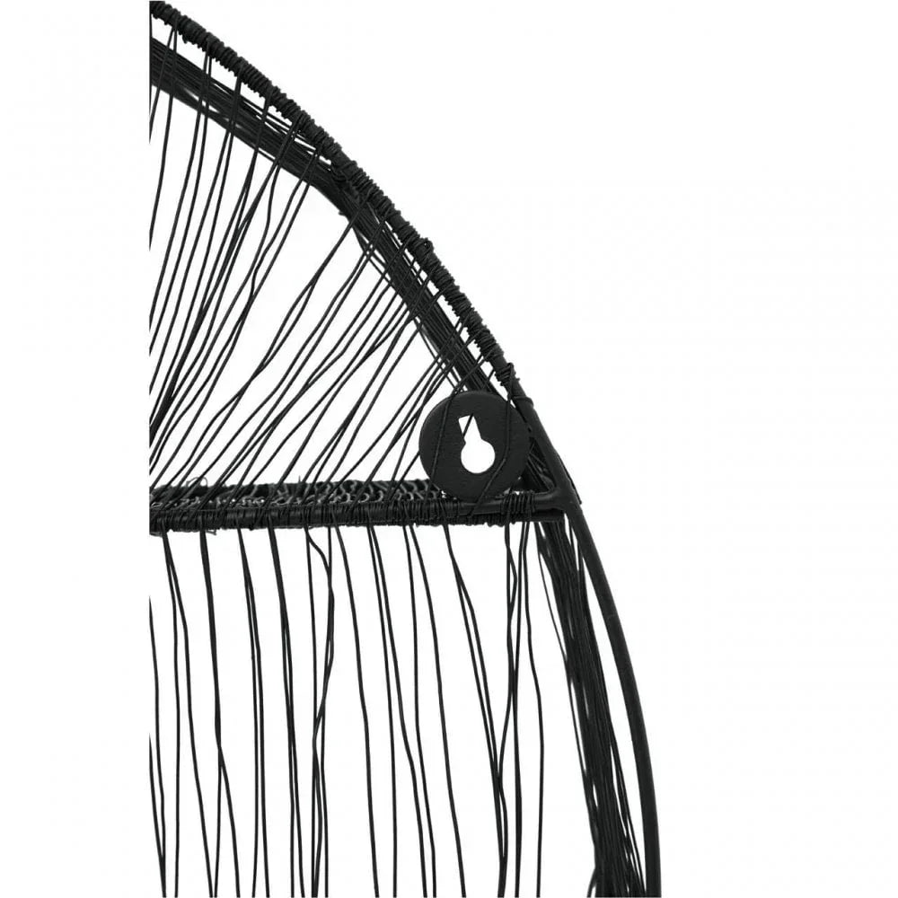 Close-up of black rattan garden chair frame with woven detailing