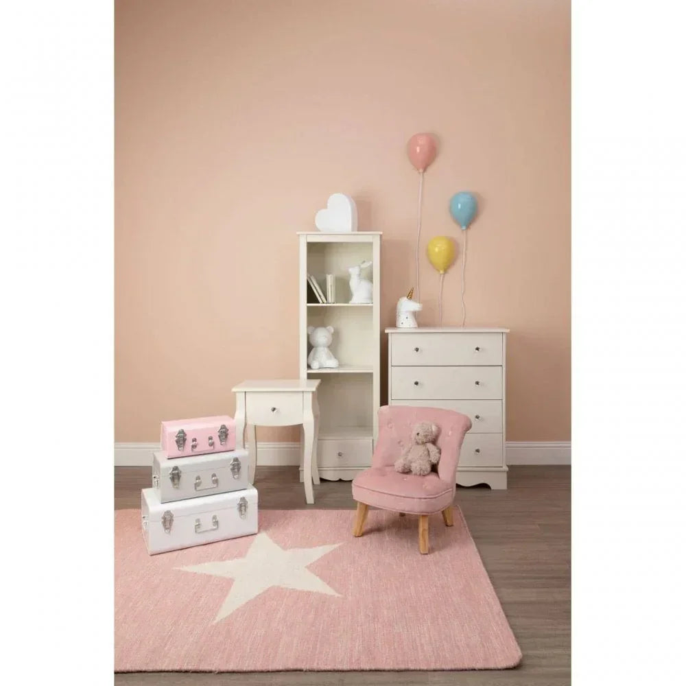 Kids bedroom furniture set with white chest, shelving, pink chair, and star rug