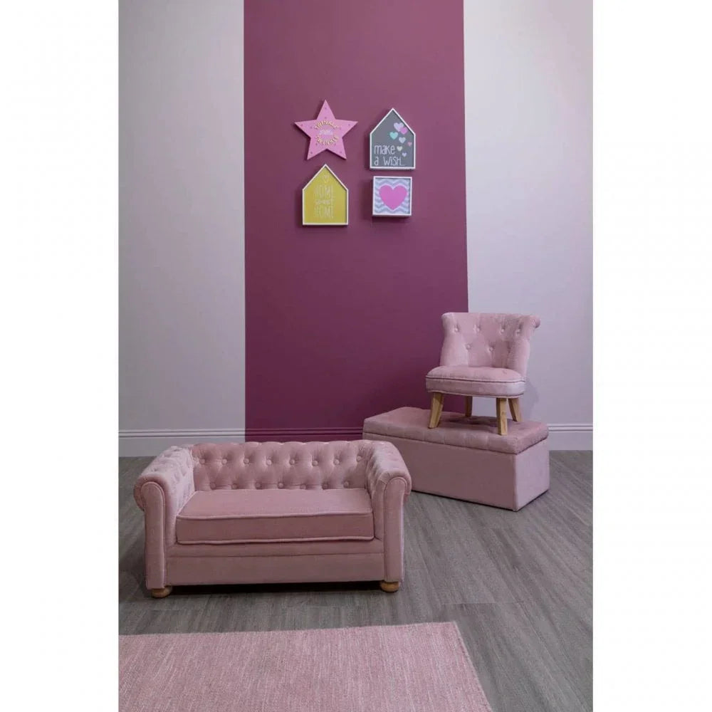 Pink velvet kids armchair and ottoman with button tufting in modern room