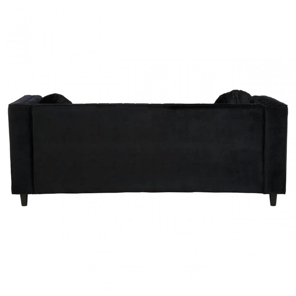 Back view of black velvet sofa with straight arms and wooden legs