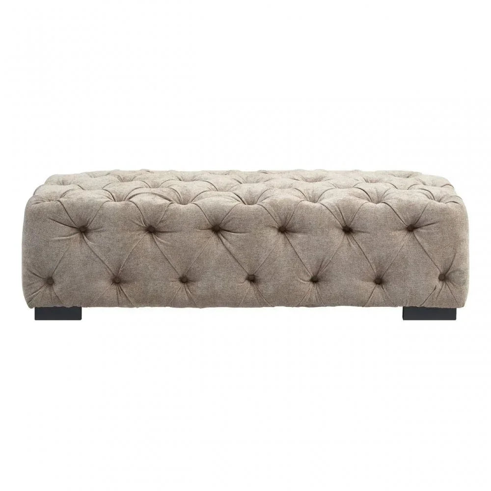 Beige fabric ottoman with deep button tufting and black wooden feet, front view