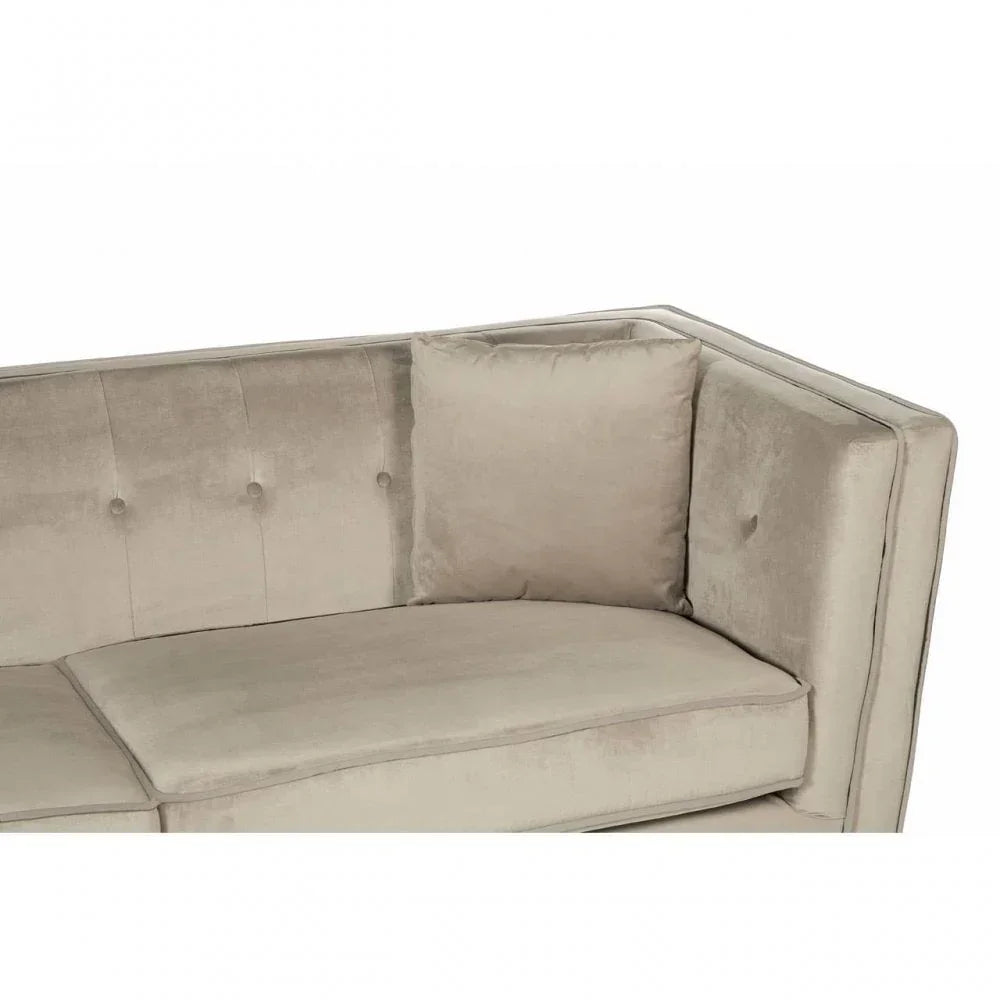 Beige velvet sofa corner with tufted backrest and matching cushion