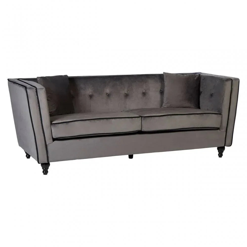 Grey velvet sofa with button-tufted back, two seat cushions and dark wooden legs