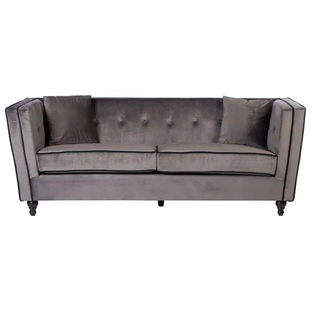 Grey velvet sofa with button-tufted backrest, two seat cushions and matching throw pillows