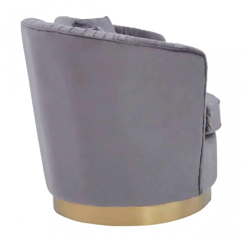 Grey velvet accent chair with gold base shown from rear angle