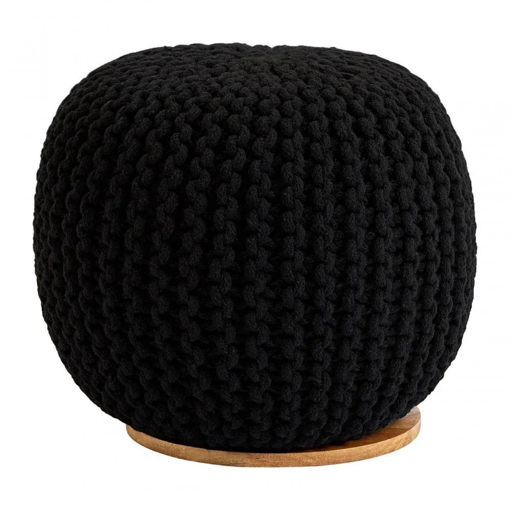 Black knitted pouffe with chunky texture on round wooden base