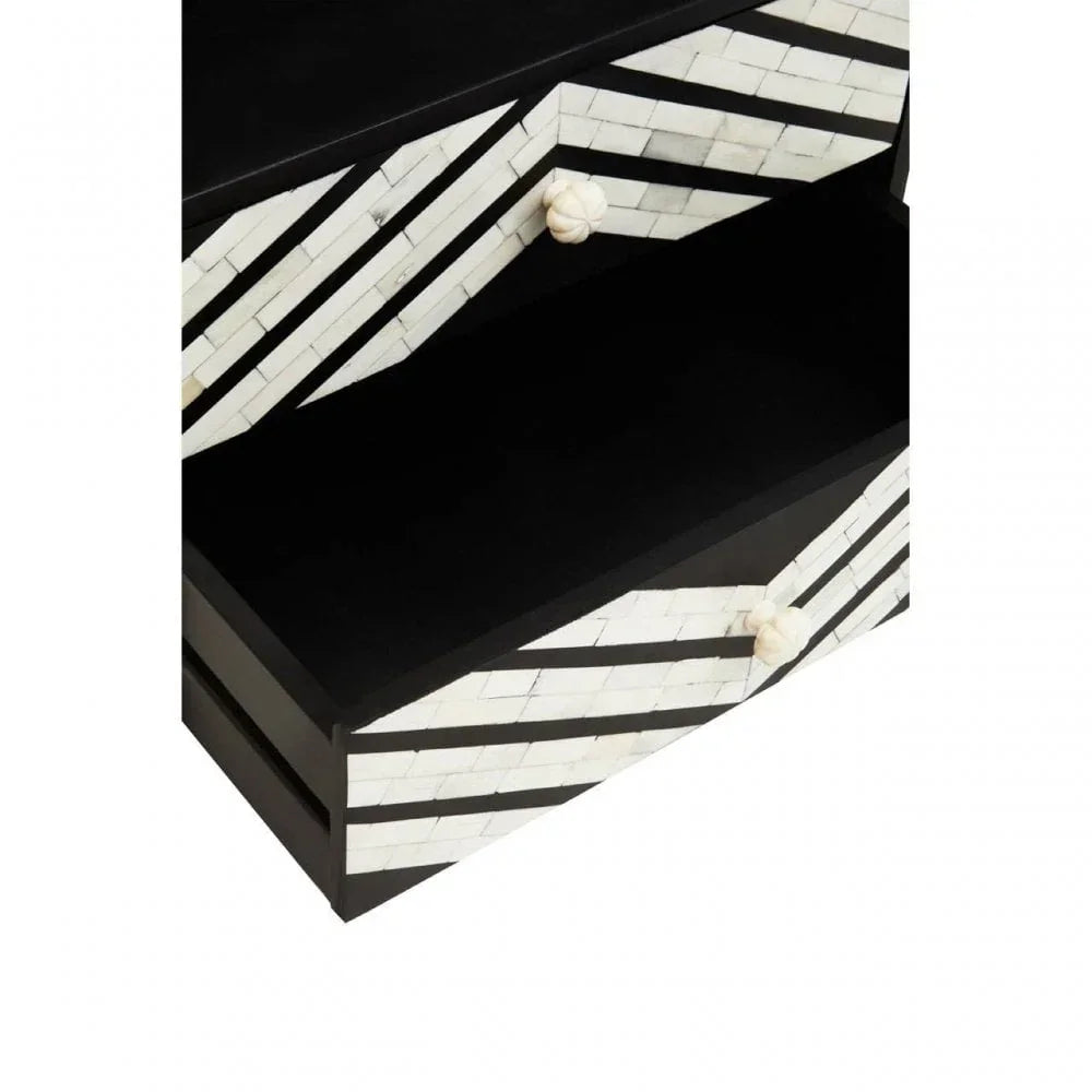 Black and white geometric drawer chest with two open drawers and round white handles