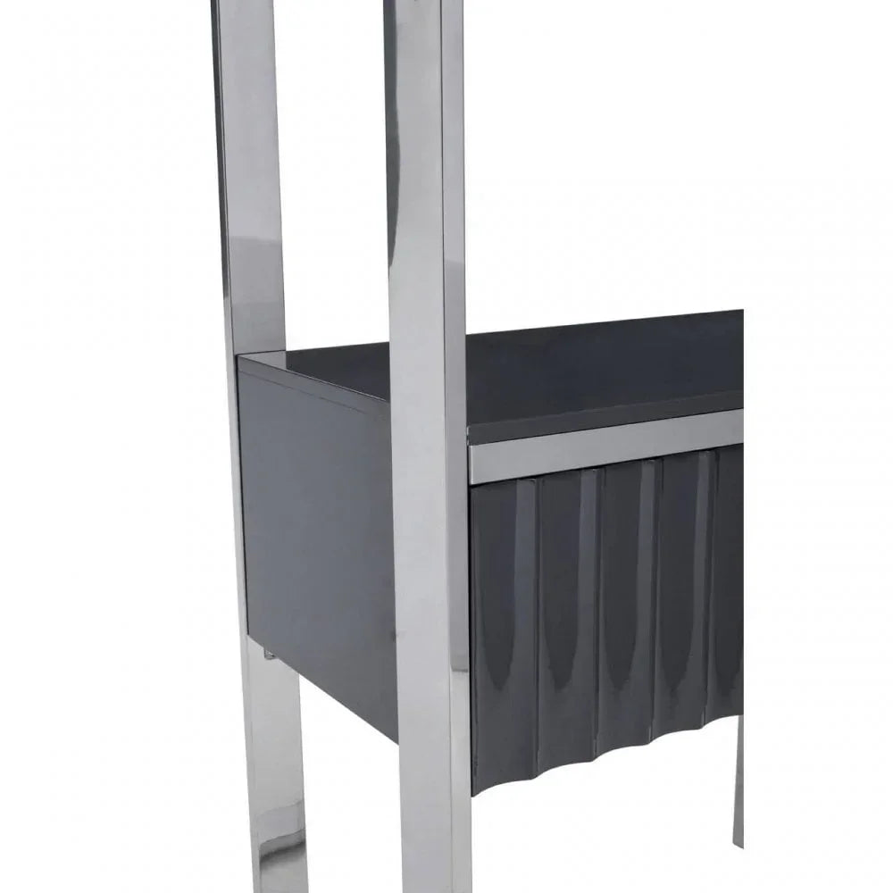 Chrome and grey dining chair leg detail with ribbed panel design
