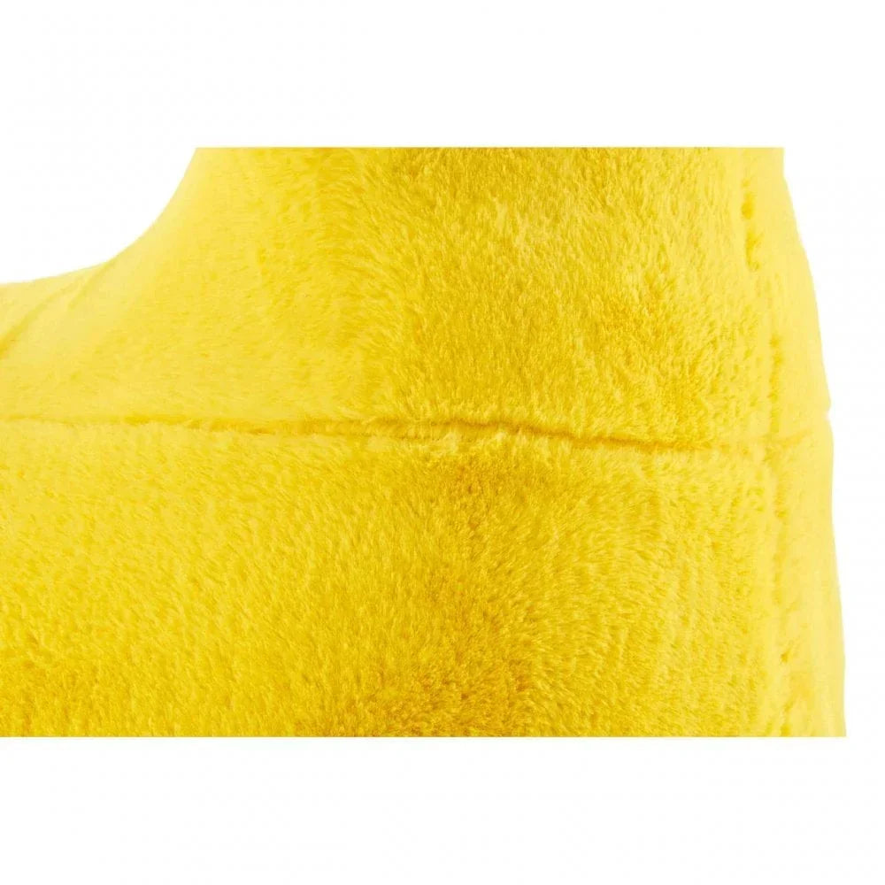 Close-up of yellow faux fur fabric on furniture upholstery