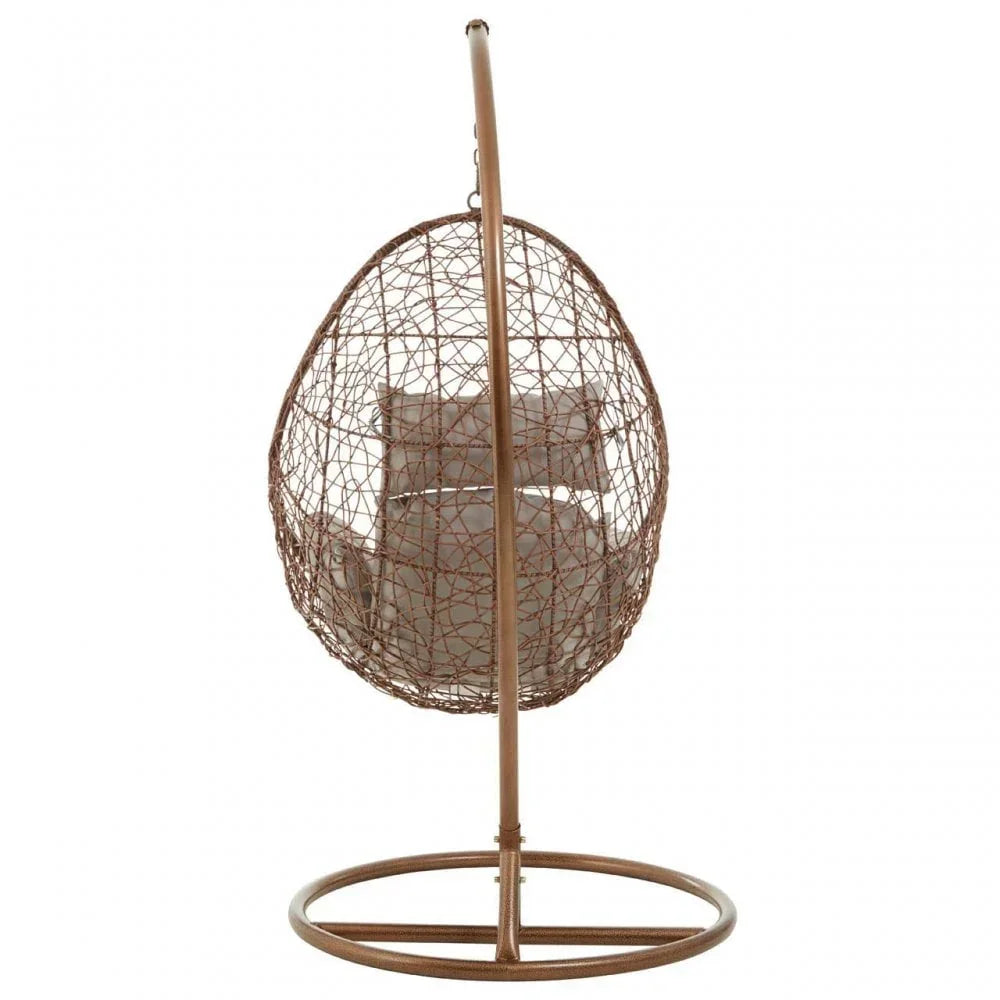 Brown rattan egg chair with beige cushions on circular metal stand