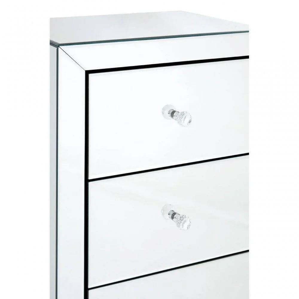 Mirrored chest of drawers with glass knobs and sleek edges, close up angle