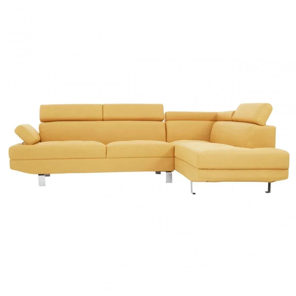 Yellow corner sofa with adjustable headrests and chrome legs, left-facing chaise design