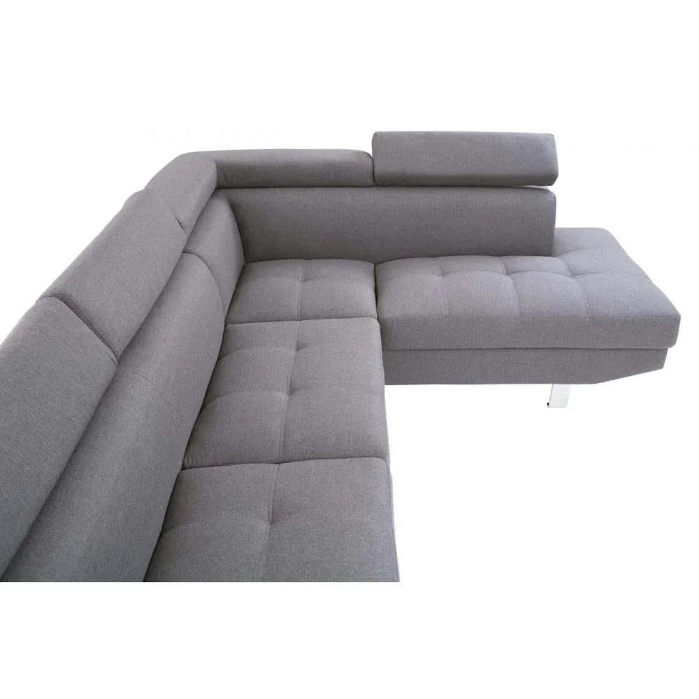 Grey corner sofa with tufted seats and adjustable headrests, modern design, angled top view