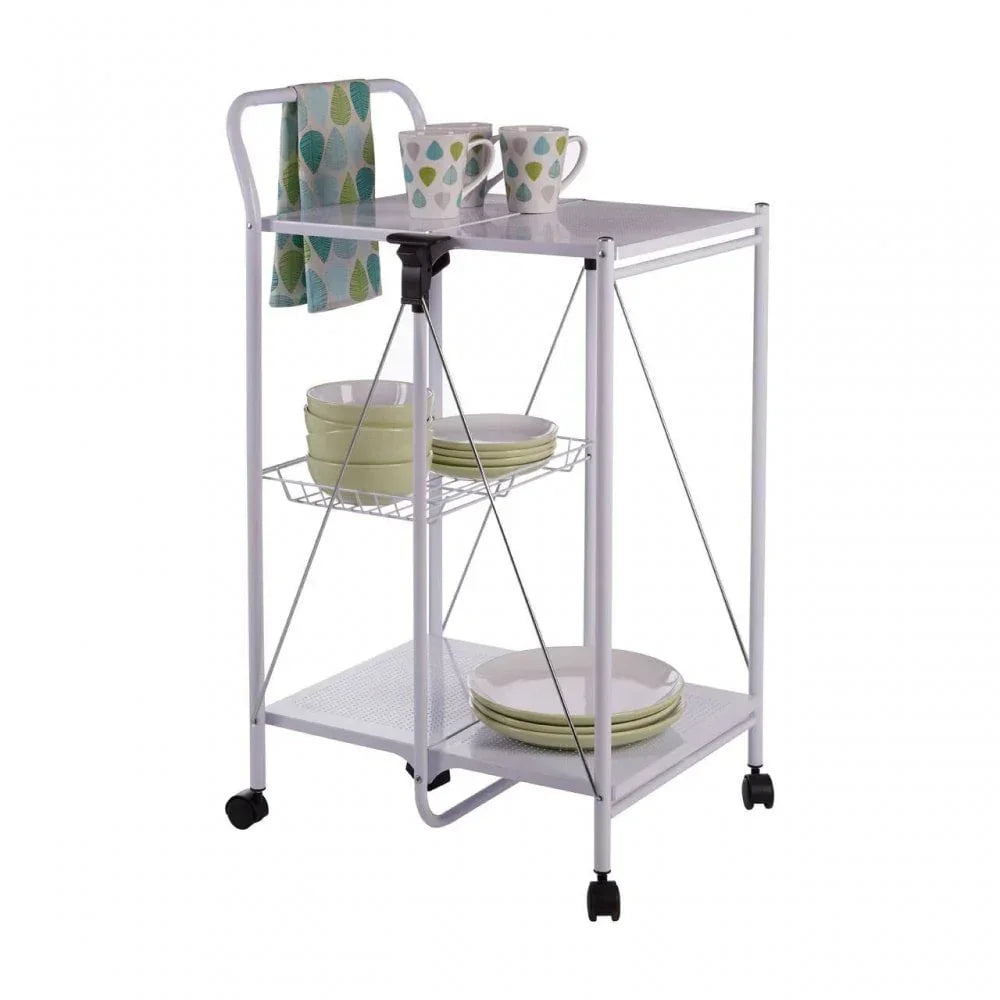 White metal kitchen trolley with wheels, two shelves, mugs, plates, bowls, and teal towel