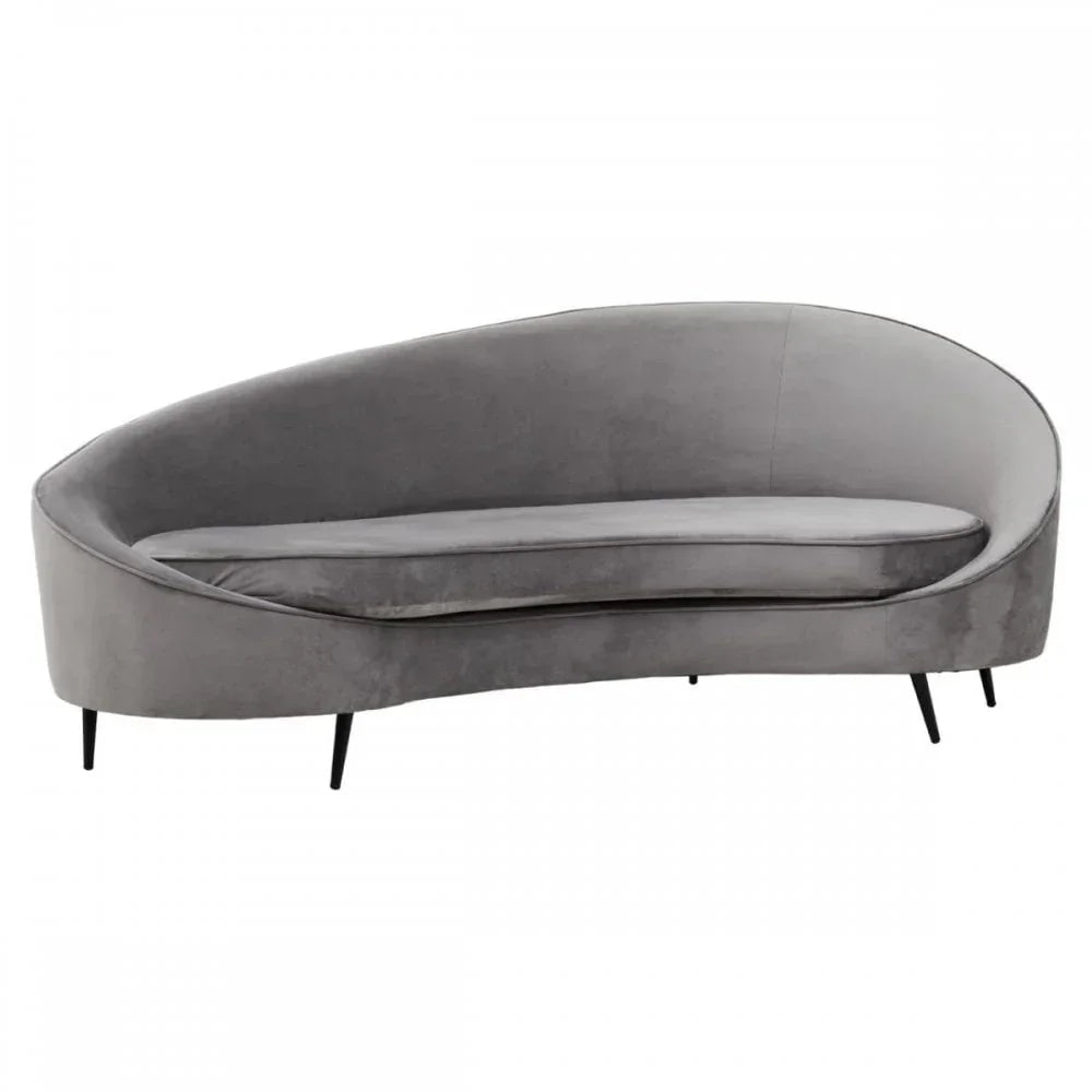 Grey velvet sofa with curved back and slim black legs on white background