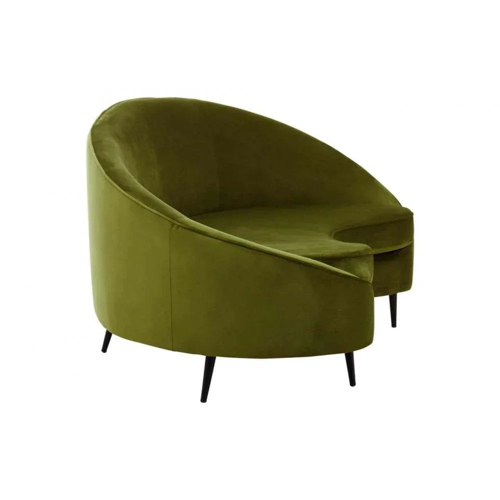 Green velvet accent chair with rounded back and black legs, angled side view