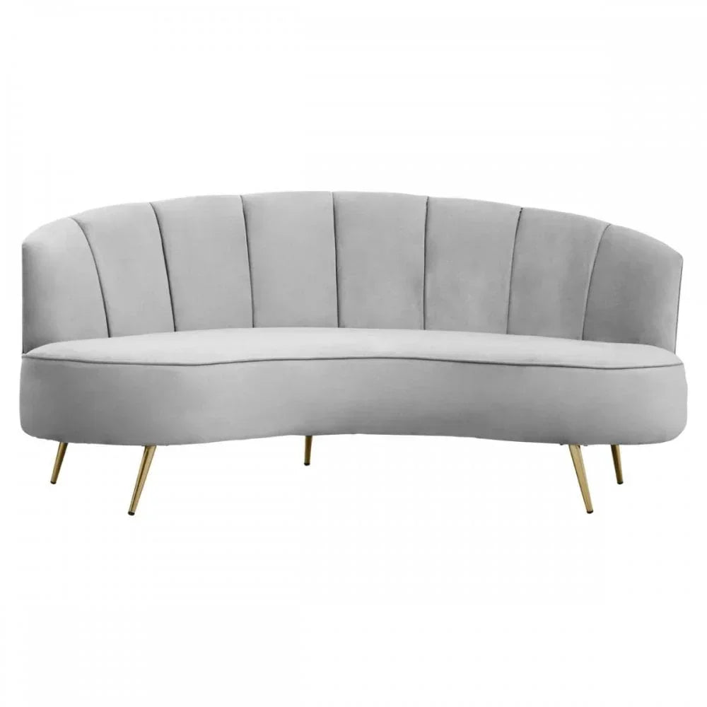 Curved grey velvet sofa with vertical panel backrest and gold metal legs