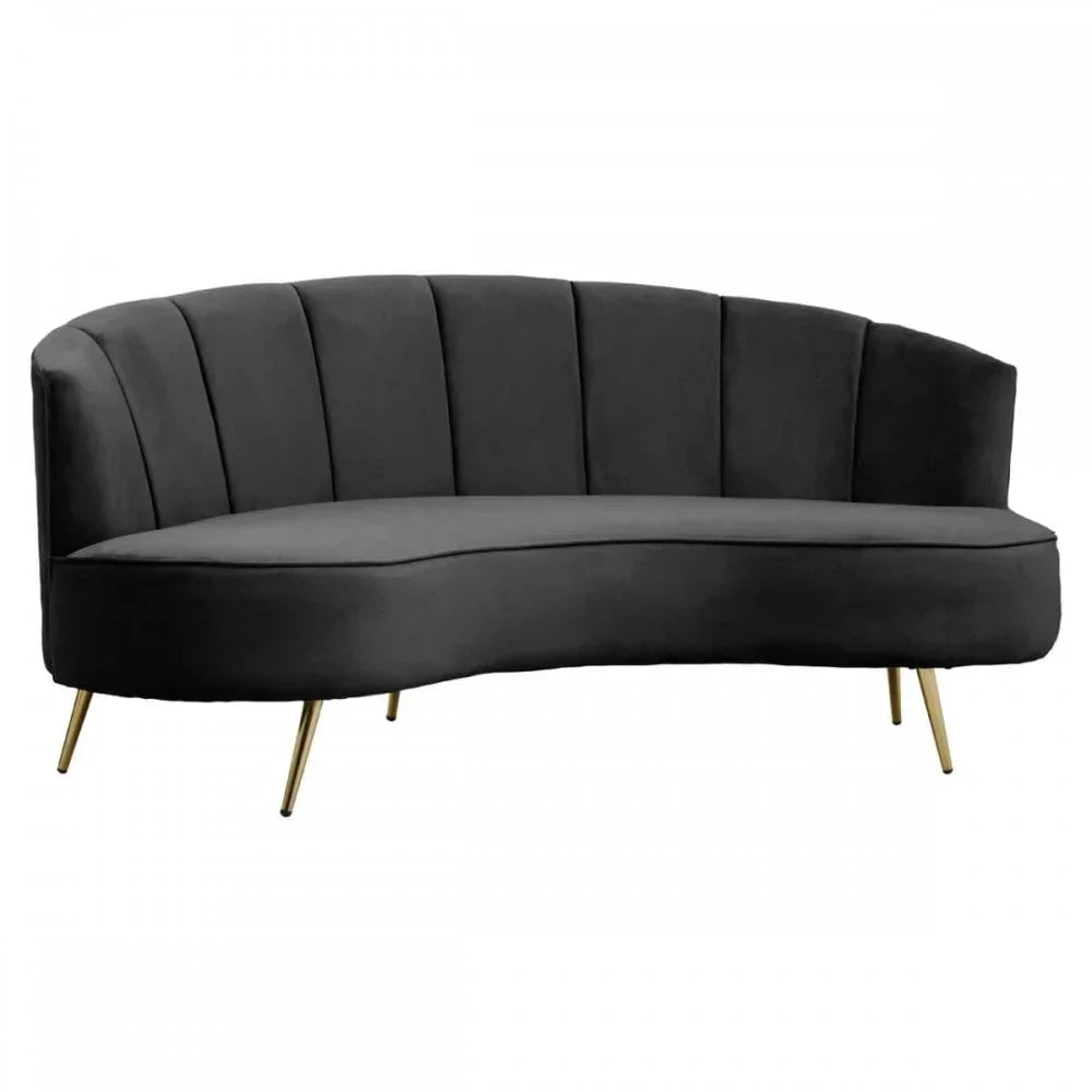 Curved black velvet sofa with vertical tufted backrest and gold metal legs