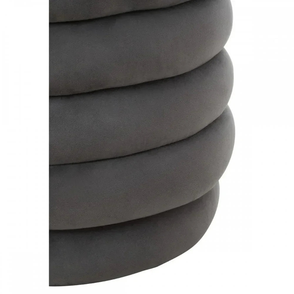 Closeup of grey velvet ottoman with layered cushion design