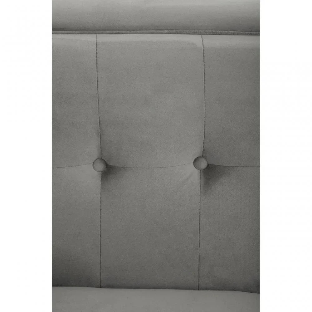 Grey fabric upholstered bed headboard with button tufted detail, close-up view