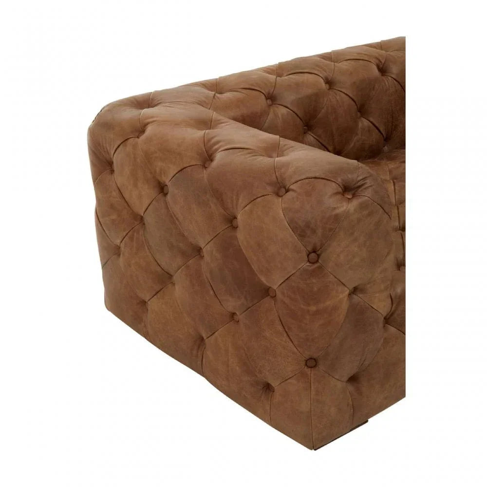 Brown leather Chesterfield sofa corner with deep button tufting detail