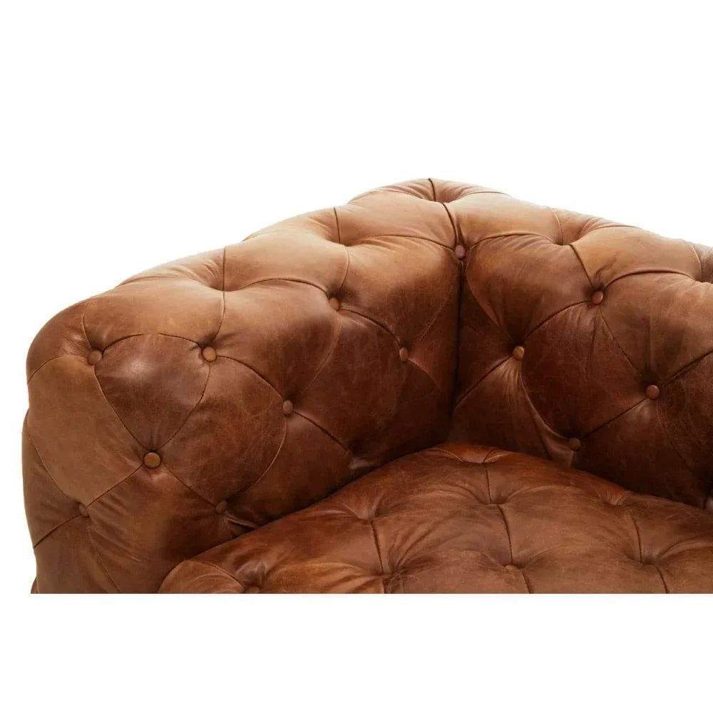 Brown leather sofa corner with deep button tufting and smooth seat cushion