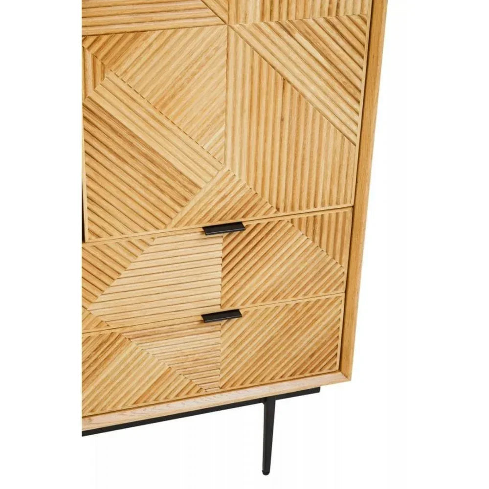 Wooden chest of drawers with geometric carved front and black metal legs