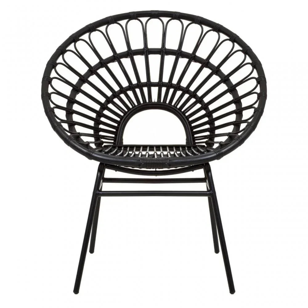 Black rattan accent chair with round open back and slim metal legs, front view