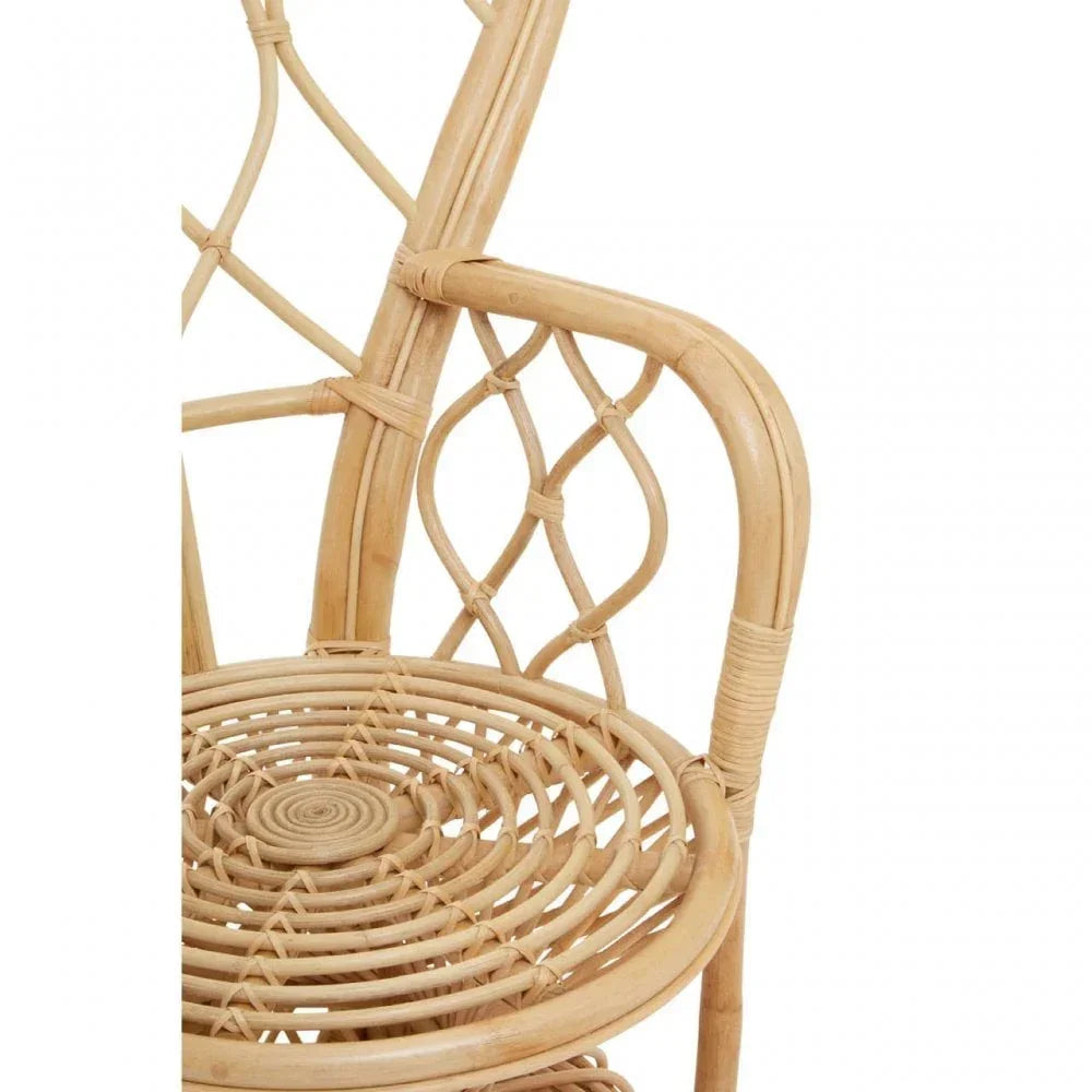 Natural rattan dining chair with woven seat and decorative curved backrest detail