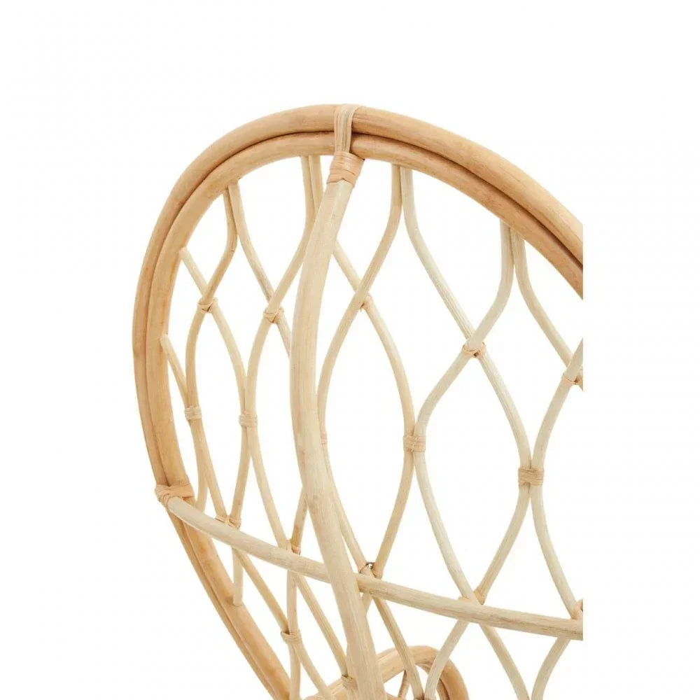 Curved rattan chair backrest with woven diamond pattern and natural finish