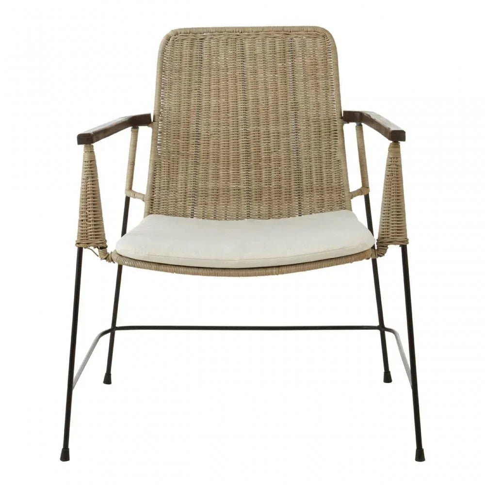 Rattan dining chair with black metal legs and cream seat cushion, front view