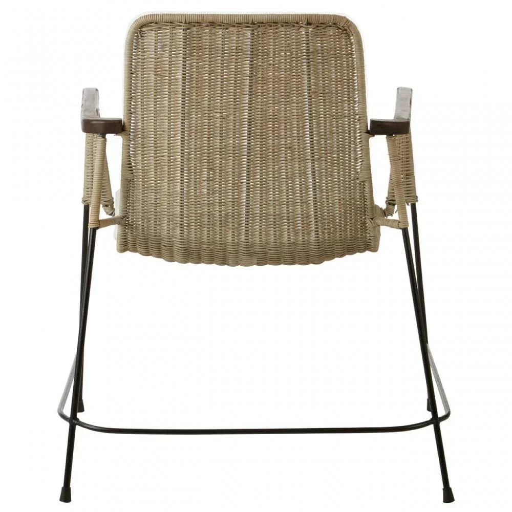 Rear view of woven rattan armchair with metal frame and light wood armrests