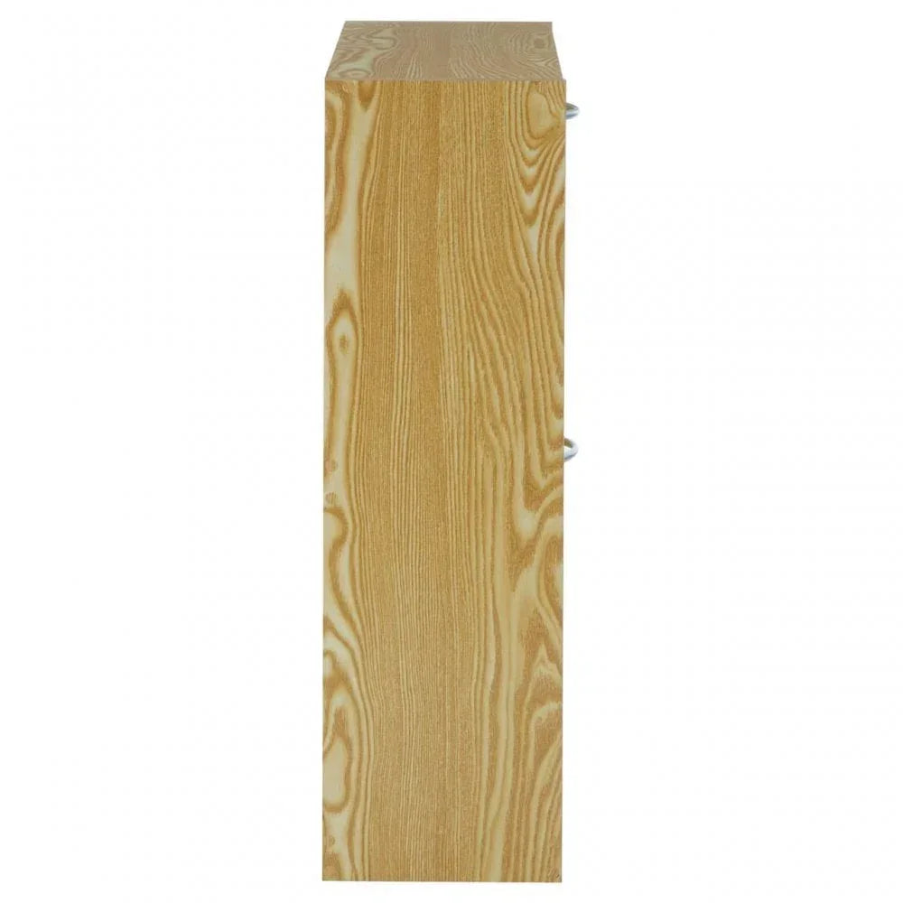Side view of light wood cabinet with natural grain texture and silver handles visible